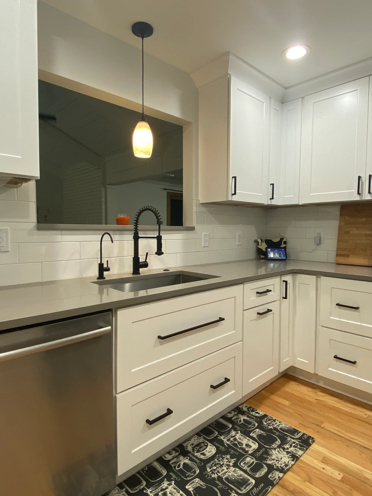 White kitchen cabinetry and a sink area in a genuine MH Design House project.