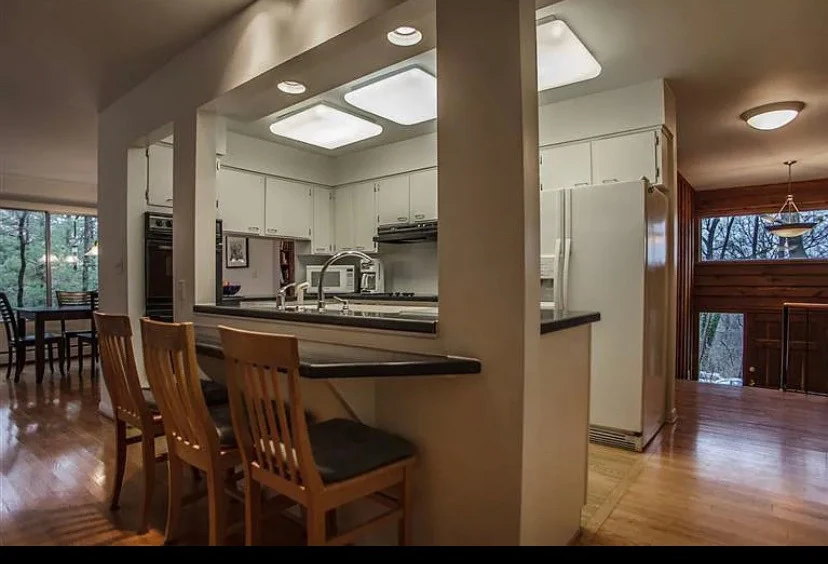 Dining area beside a kitchen in a MH Design House project.